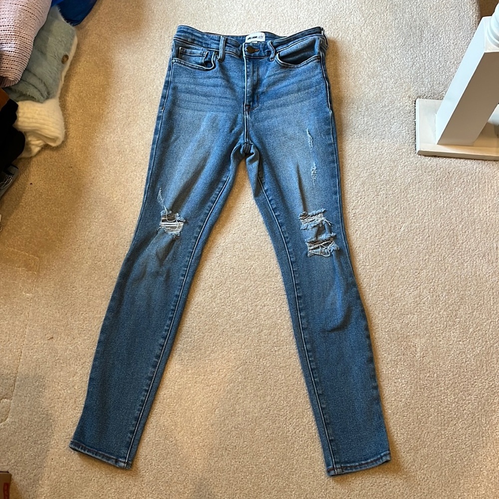 High-rise blue ripped jeans
